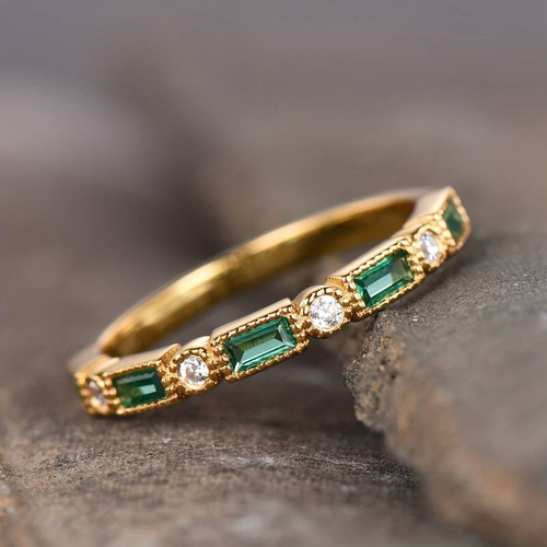 Vintage gold ring with embedded green zircon